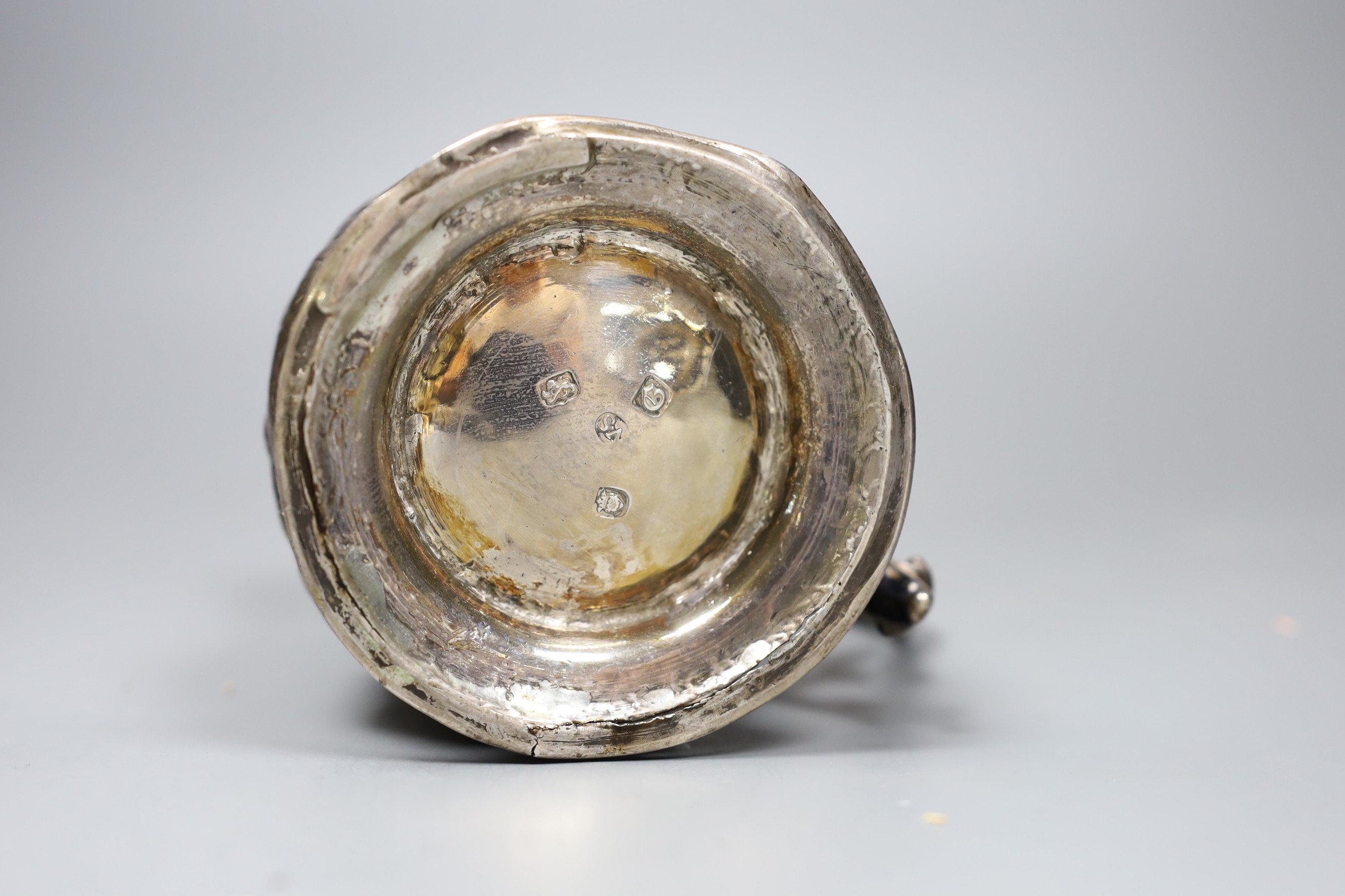 An early George III silver mug, with later-embossed floral detail, London 1762, 12cm.